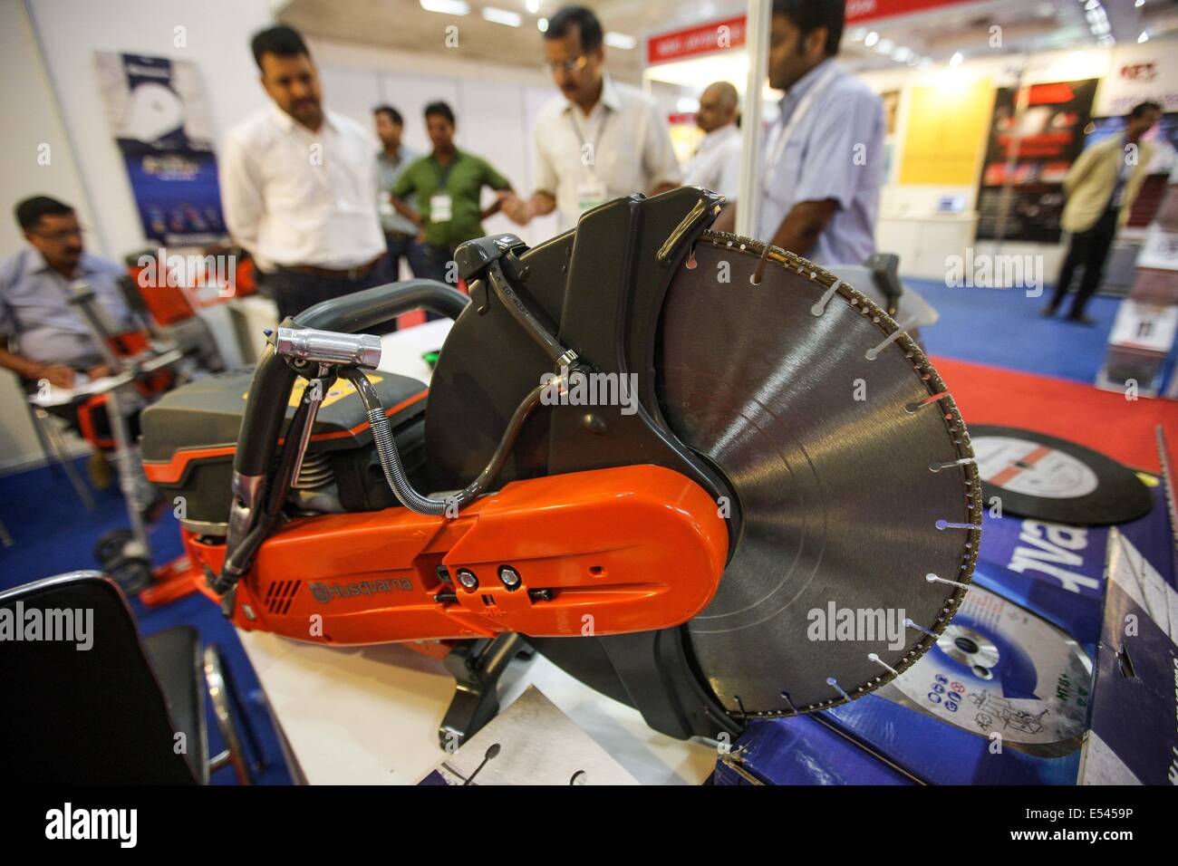 New Delhi, India. 20th July, 2014. Visitors enquire about the cutter for rescue missions at the International Police Expo in New Delhi, India, July 20, 2014. Exhibitors from several countries and regions displayed their products at the International Police Expo in New Delhi on Sunday. © Zheng Huansong/Xinhua/Alamy Live News Stock Photo