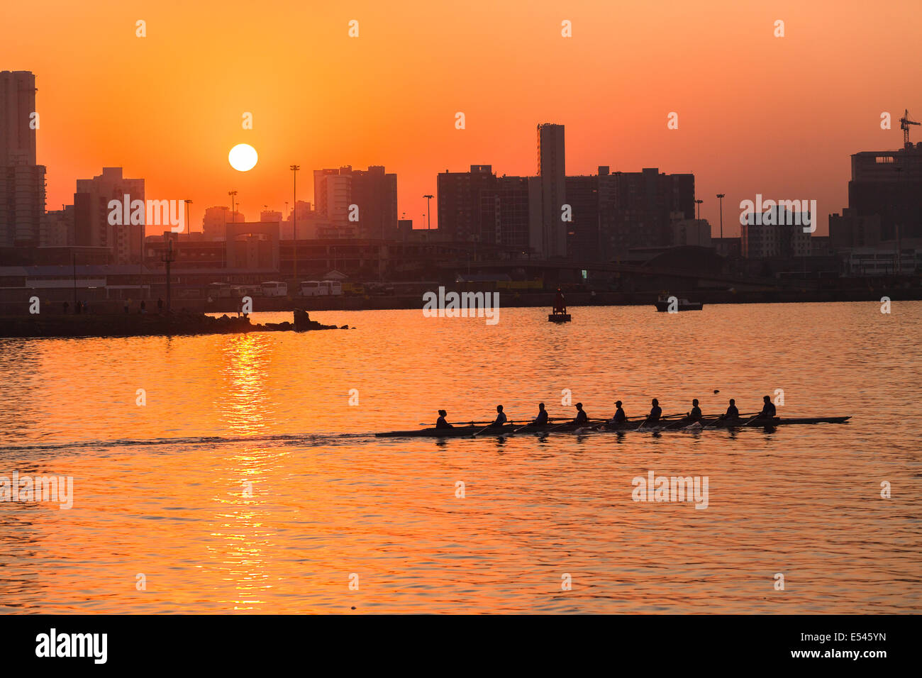 Regatta Rowing action athlete rowers on Durban harbor waters Stock Photo