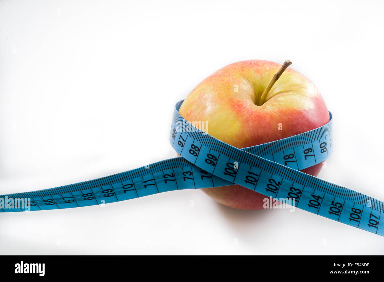 apple with tape measure Stock Photo