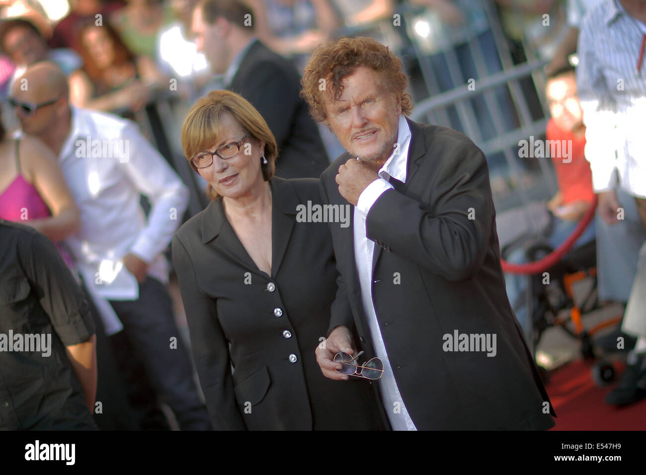 Firector Dieter Wedel and Uschi Wolters arrive to the premiere of this year's Nibelungen Festival piece 'Hebbels Nibelungen - born this way' in Worms, Germany, 18 July 2014. It is the last staging by Wedel as festival director and there will be 16 performances from 18 July to 03 August. Photo: FREDRIK VON ERICHSEN/dpa Stock Photo