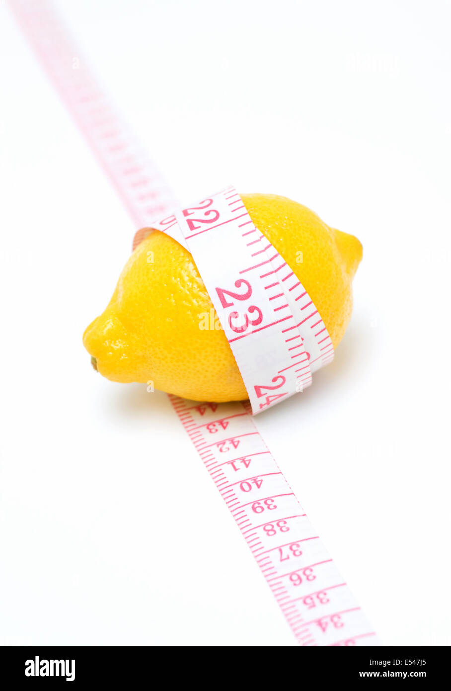 Lemon and Tape measure isolated on white background Stock Photo