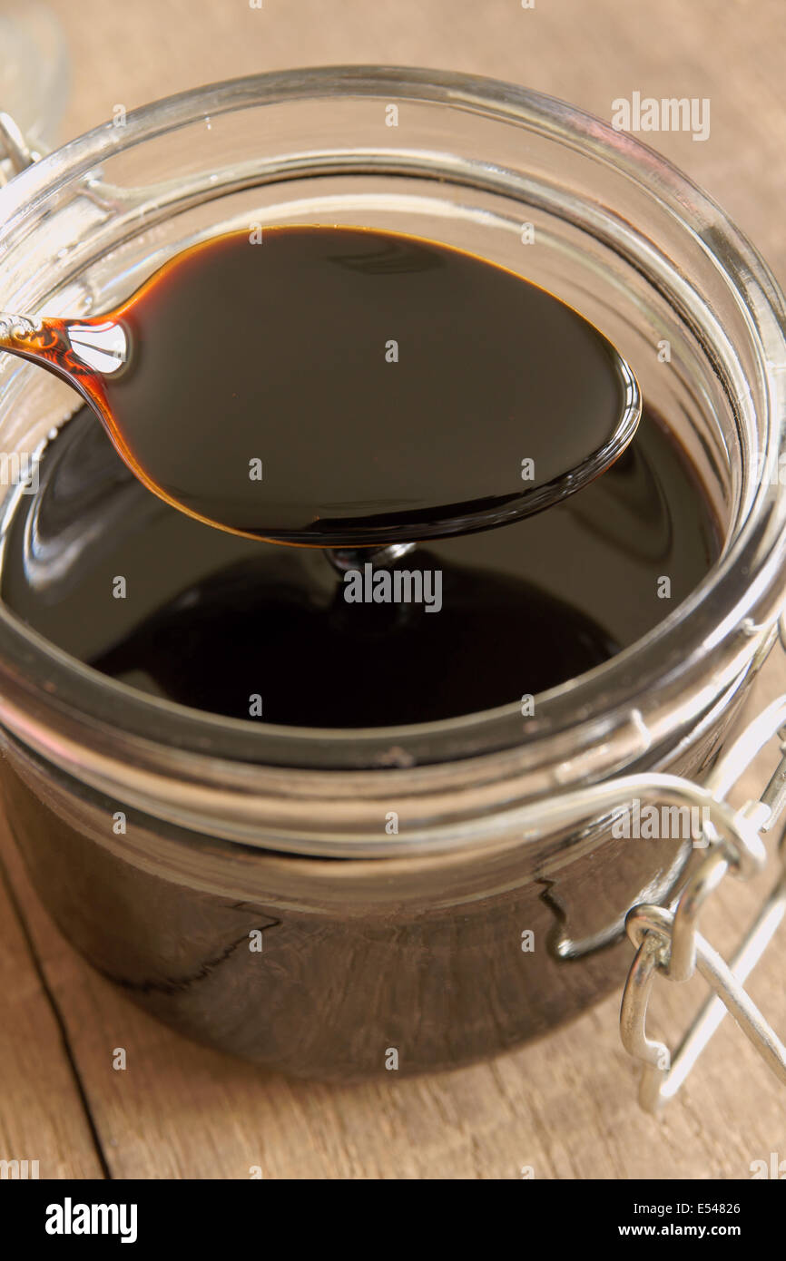 Black Treacle or molasses in a glass jar Stock Photo Alamy