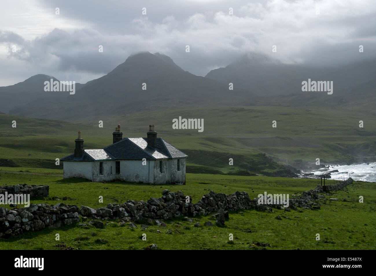 Harris Lodge and the peak of Trollaval in the Rum Cuillin hills, Harris Bay, Isle of Rum, Scotland, UK. Stock Photo