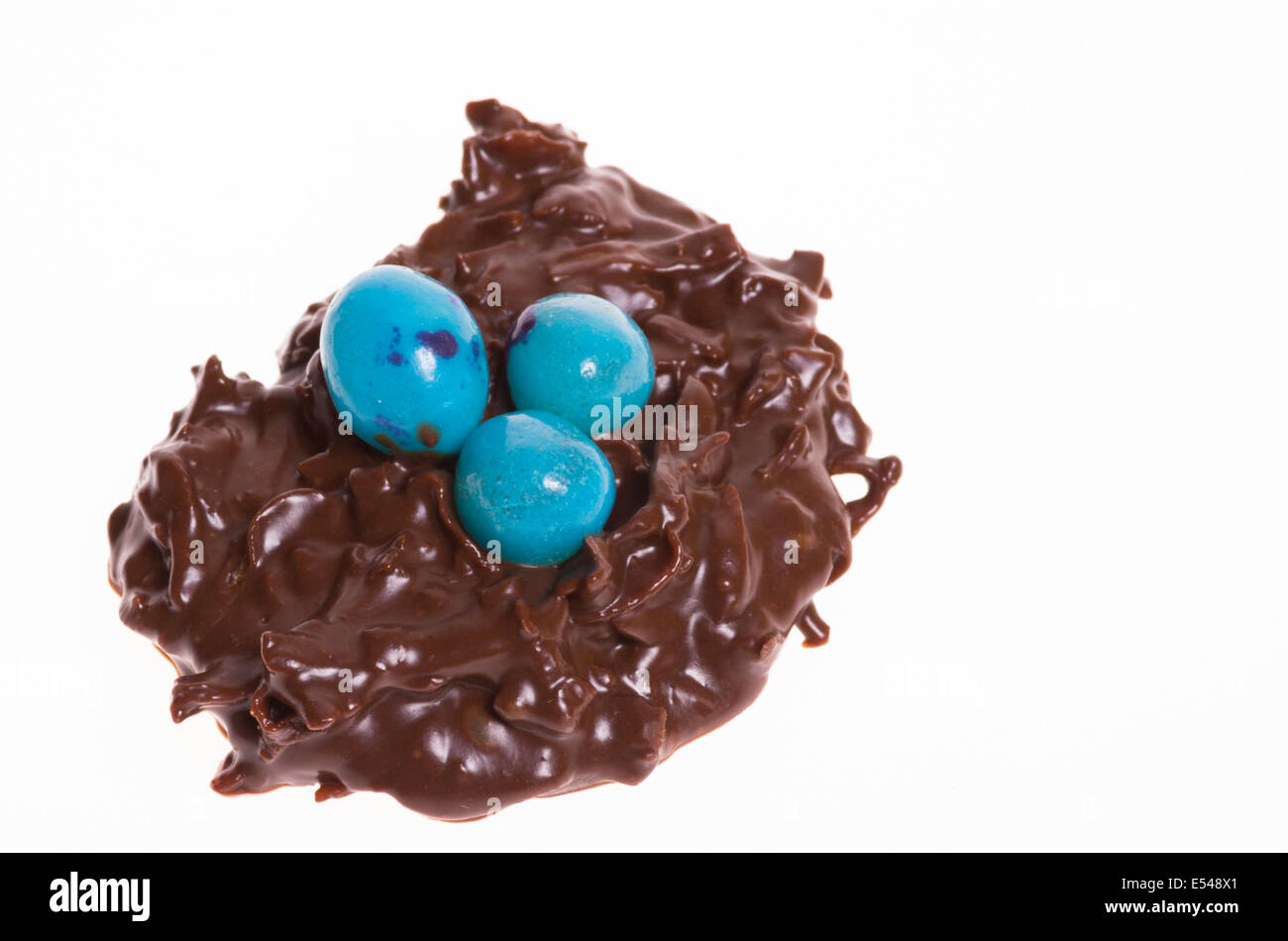 A coconut candy bird nest with blue jelly beans Stock Photo Alamy