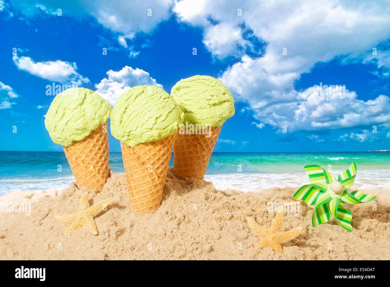 Minty flavor icecreams with pinwheel on summer beach Stock Photo