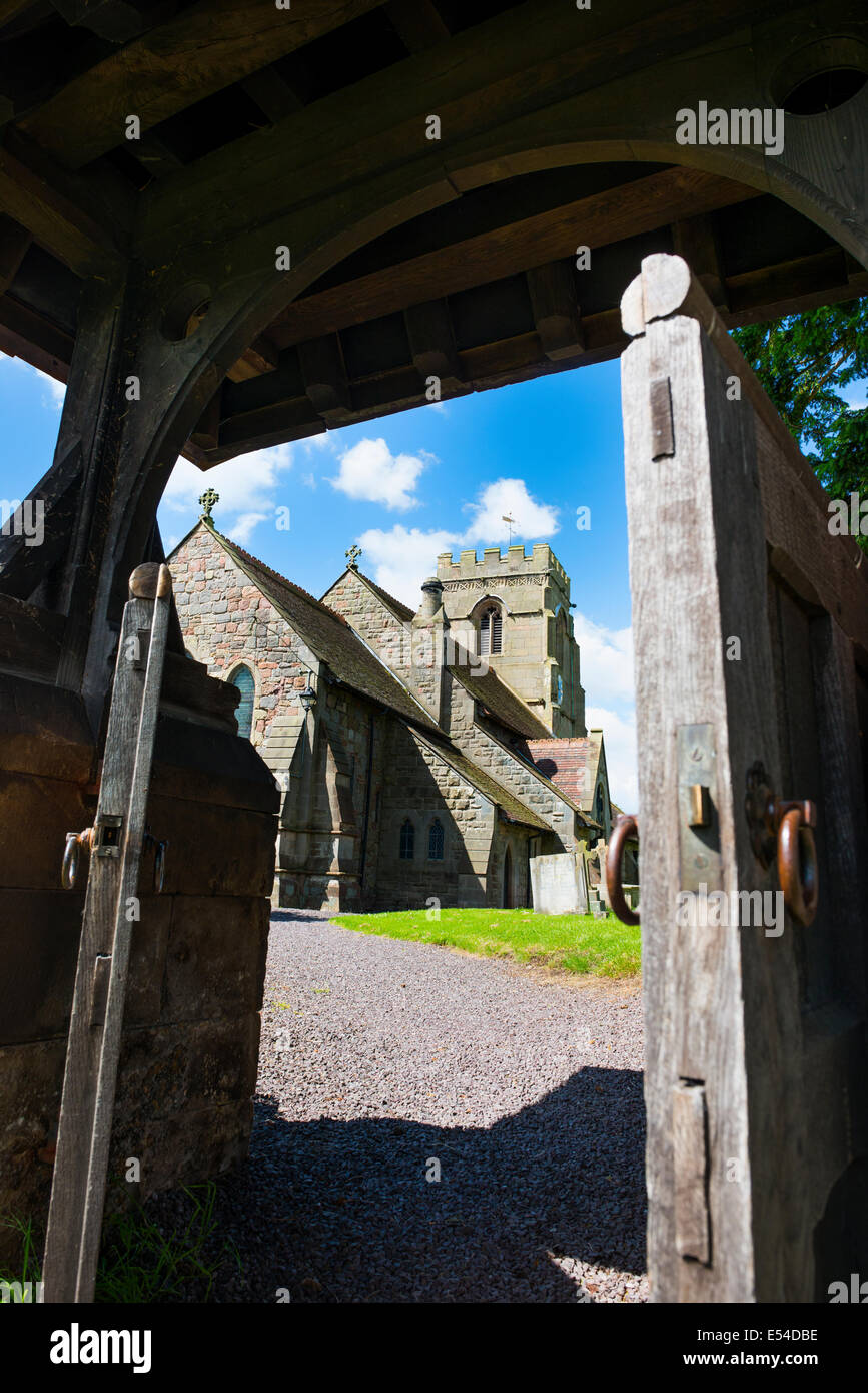Looking through the lych gate at St Lucia's Church in the village of Upton Magna, Shropshire, England. Stock Photo