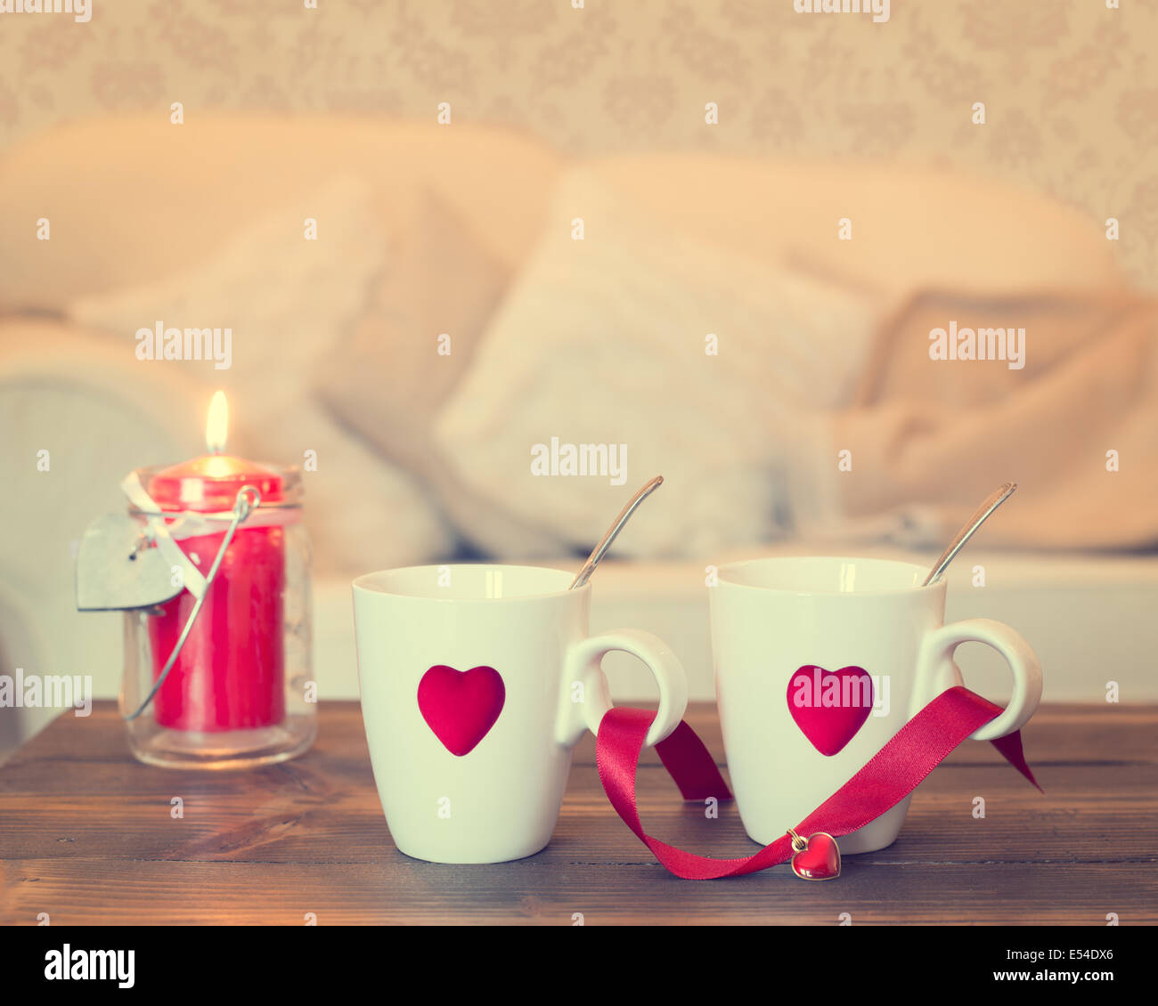 Two teacups with heart decoration - vintage effect added Stock Photo