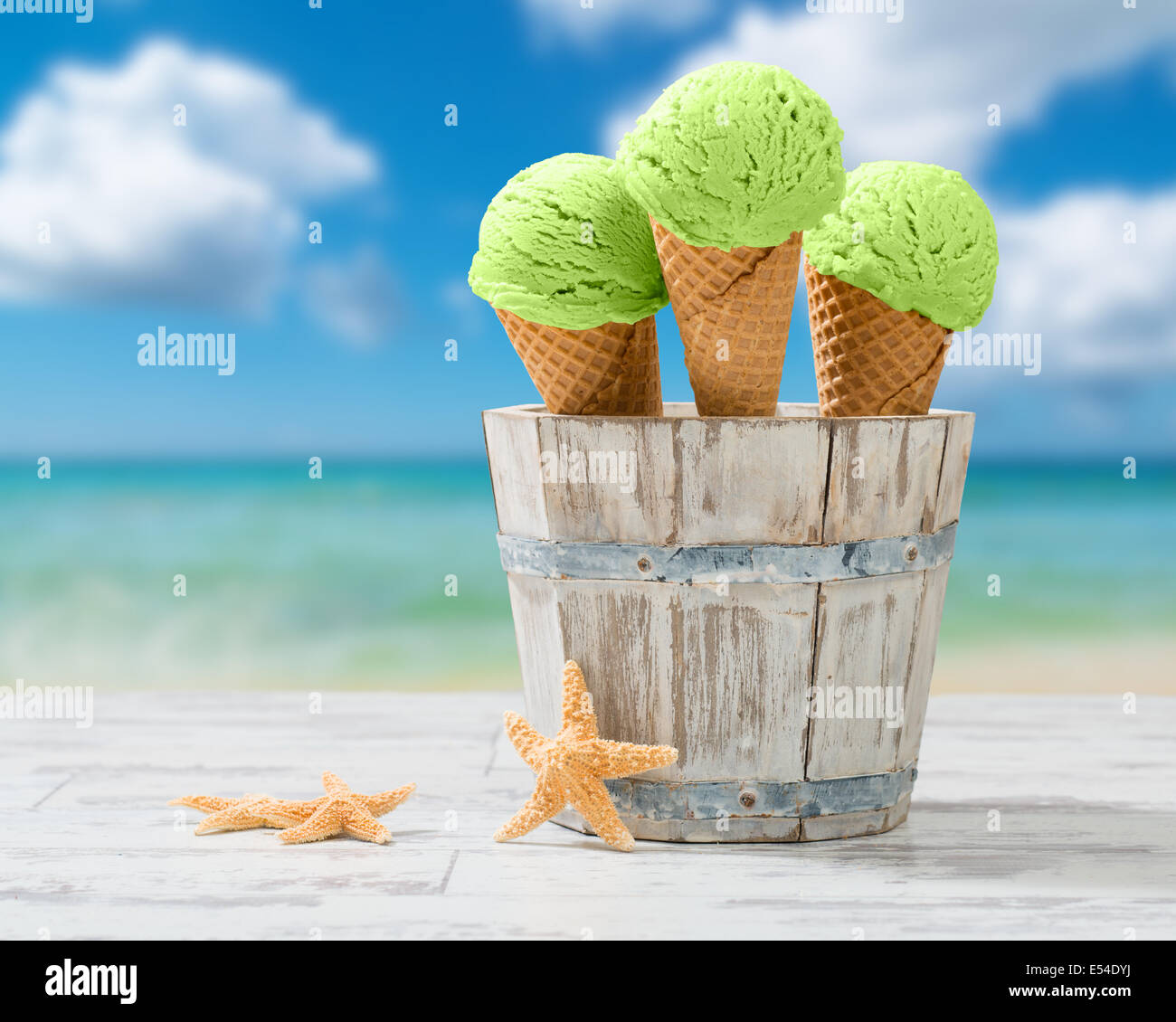Three minty ice creams in rustic bucket at the seaside Stock Photo Alamy