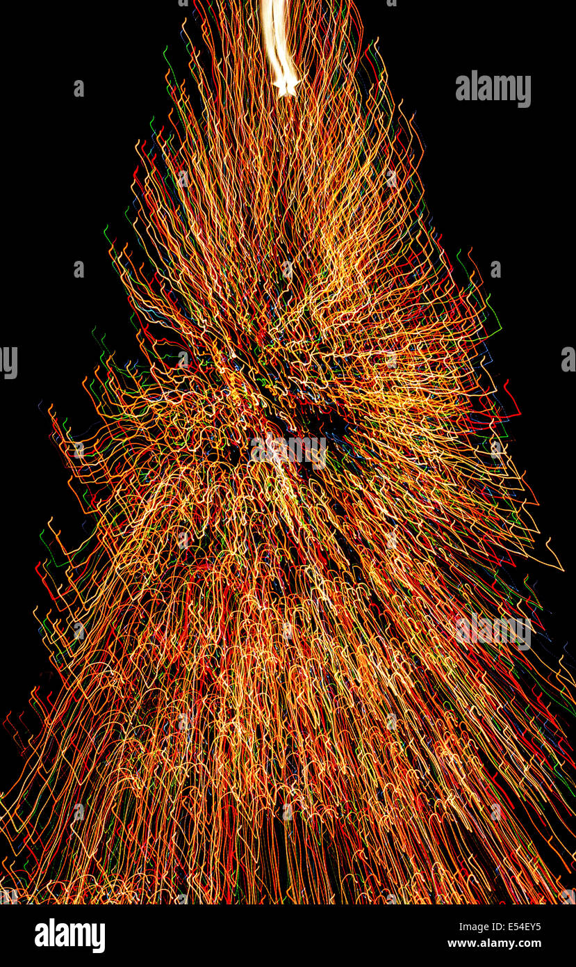 More than 20,000 multicolored lights on a huge Christmas tree create fascinating streaks for this time-exposure photo in New York City, New York, USA. Stock Photo