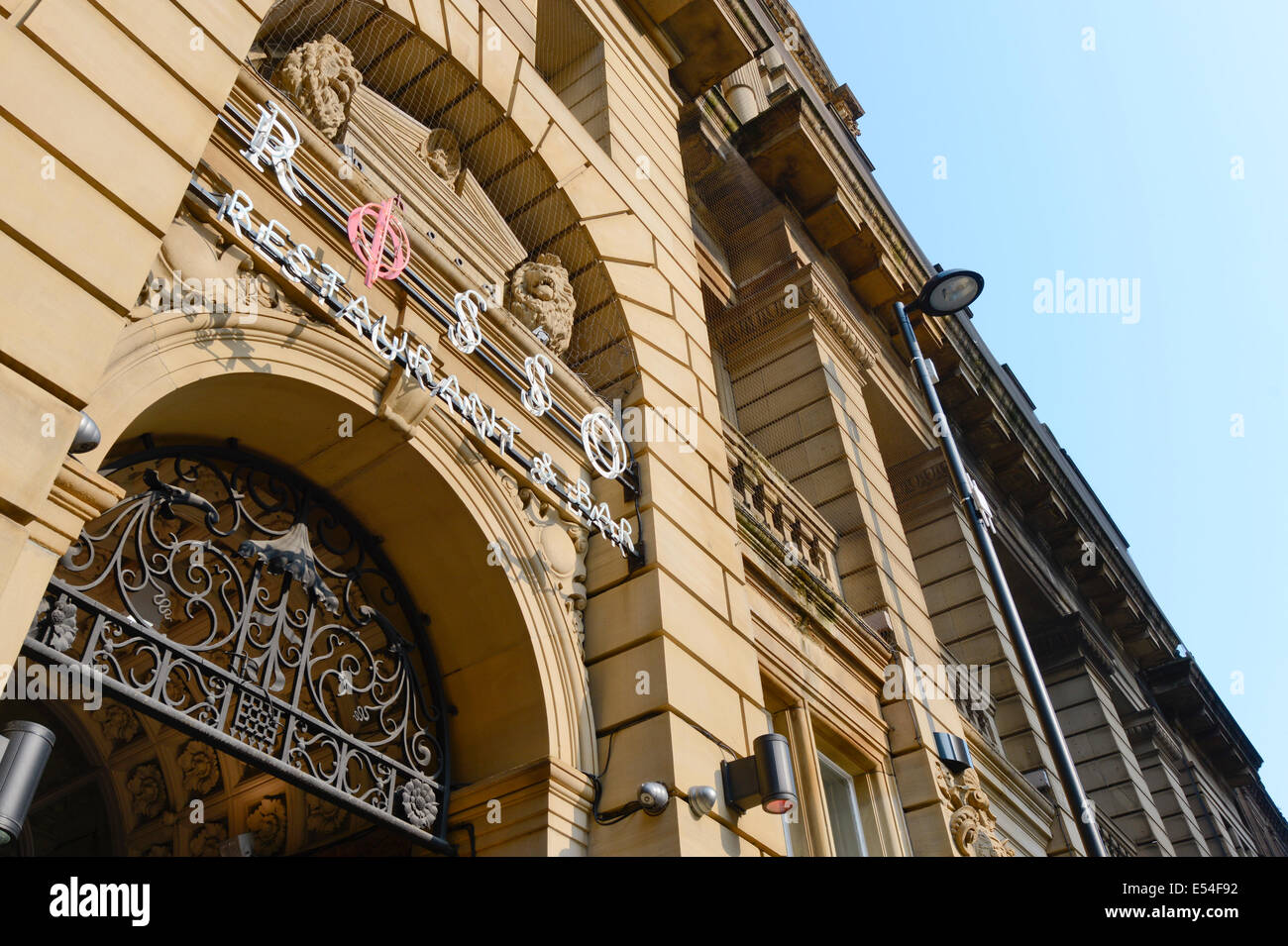 The signage above the entrance to Rosso restaurant and bar, owned by Rio Ferdinand, in the Spring Gardens area of Manchester, UK Stock Photo