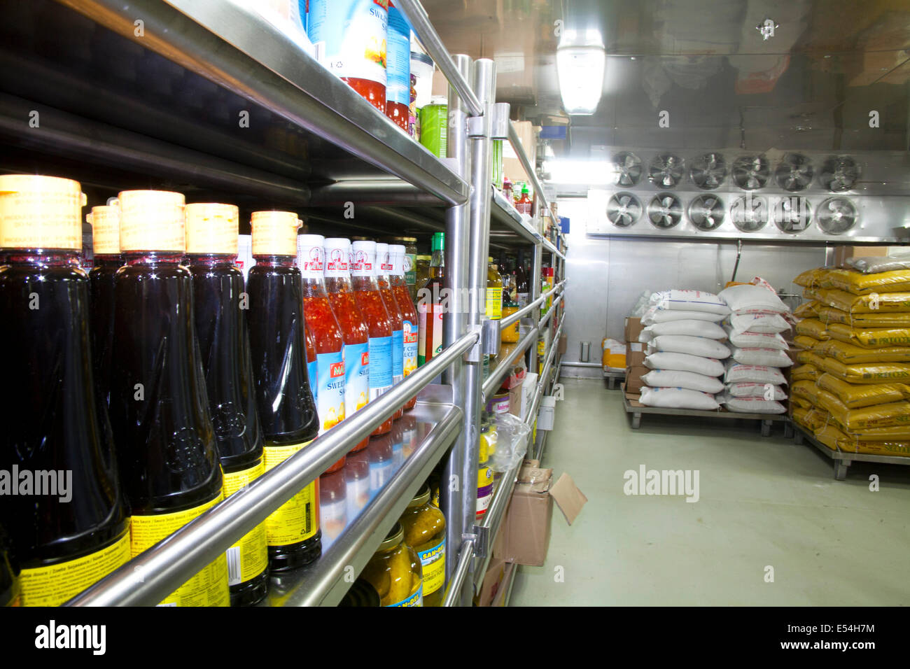 Shelves stocked with supplies in a ships galley Stock Photo - Alamy
