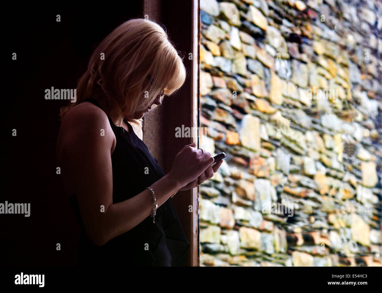 Irish Woman using a Smart Phone. Stock Photo