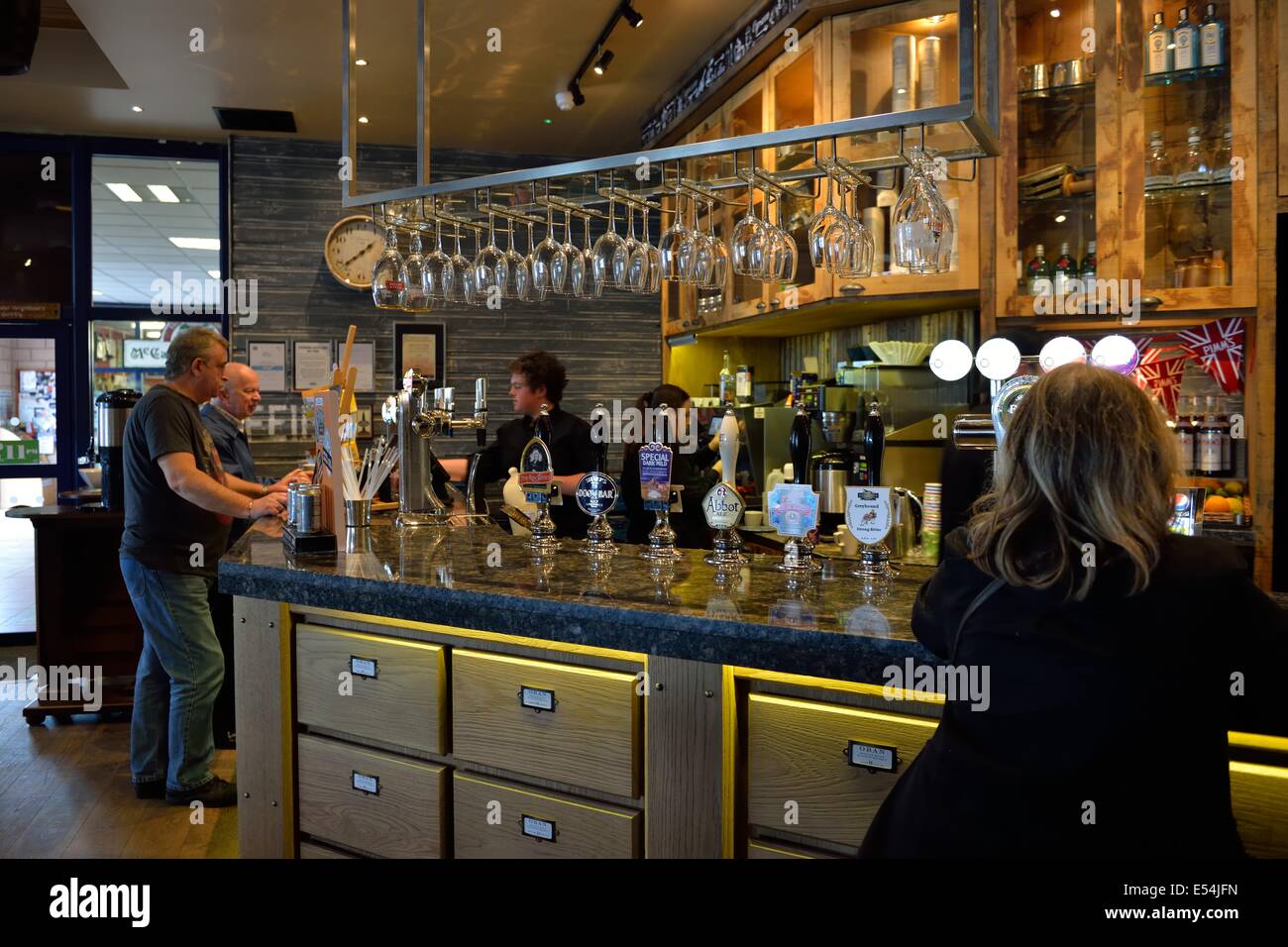 Customers at the bar area of the Corryvreckan wine bar on Oban pier, Scotland. Stock Photo