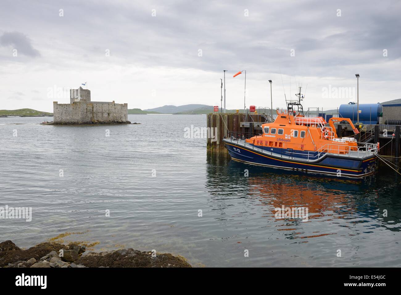 Barra lifeboat and Kisimul Castle in Castlebay, Hebrides, Scotland, UK Stock Photo