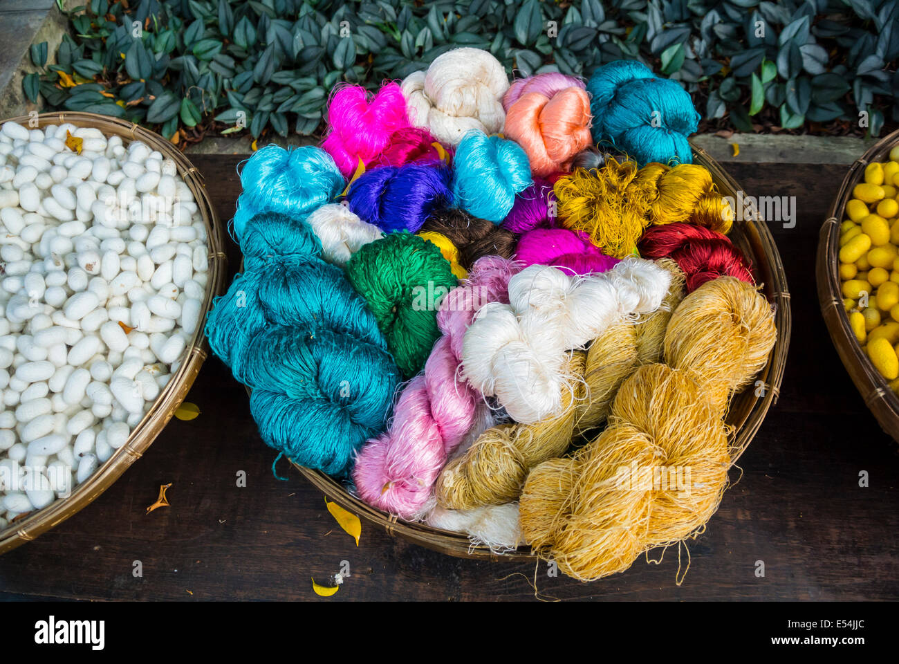 colorful Thai silk threads in a basket, Bangkok, Thailand Stock Photo