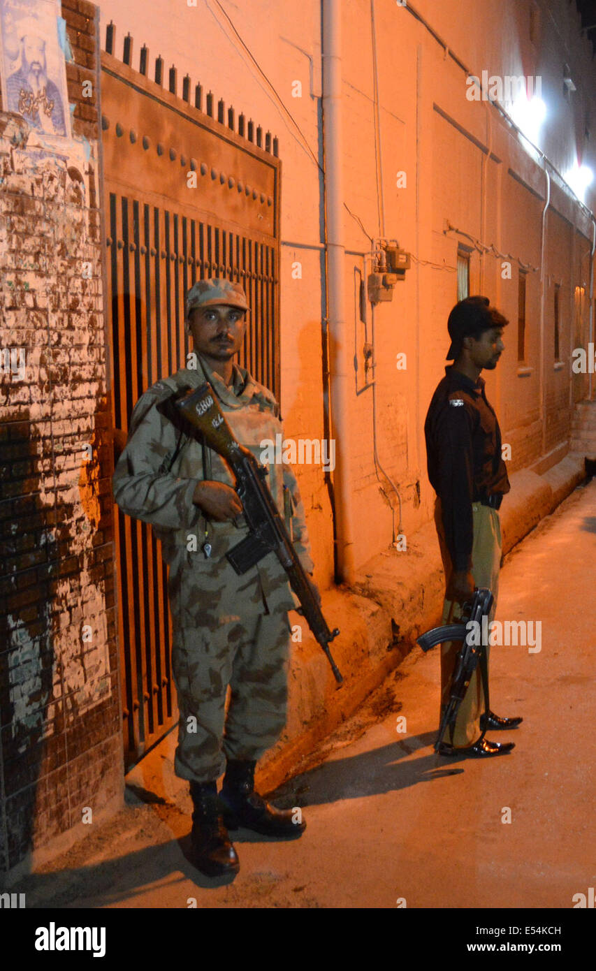 Quetta. 20th July, 2014. Pakistani security officials stand guard