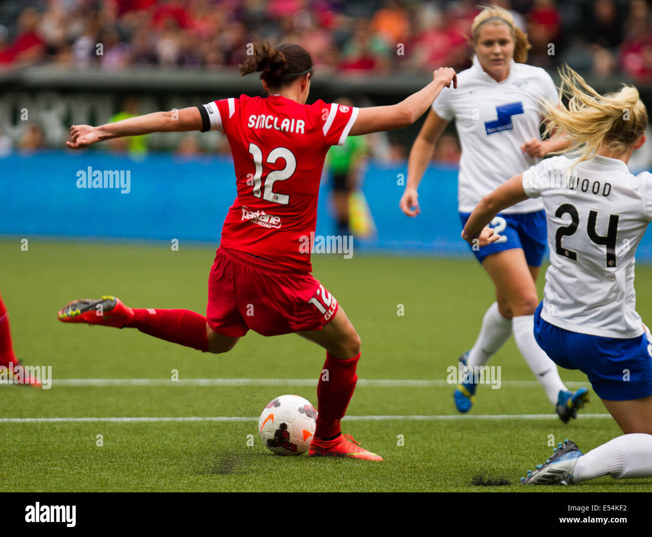 July 20, 2014 - Portland's CHRISTINE SINCLAIR (12) takes a shot on goal and scores the first of her three goals in the game. The Portland Thorns FC play the Boston Breakers at Providence Park on July 20, 2014. © David Blair/ZUMA Wire/Alamy Live News Stock Photo