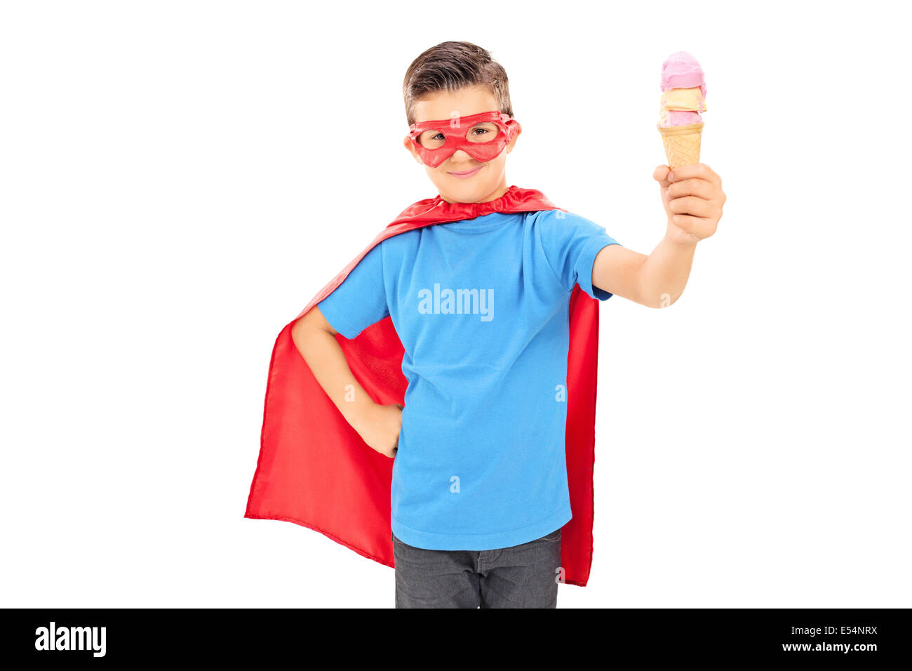 Cute junior in superhero costume holding an ice cream Stock Photo