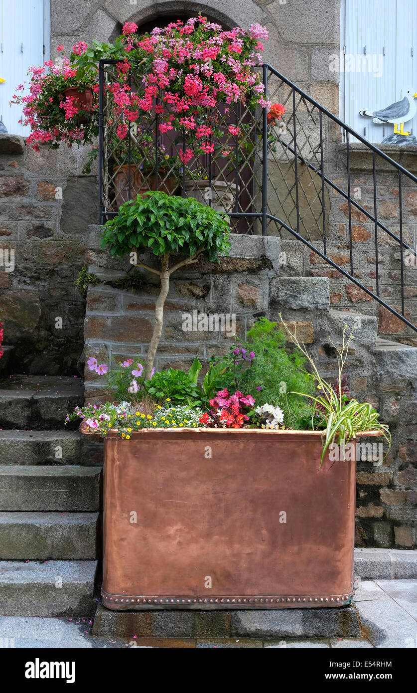 large copper flower container, villedieu les poeles, normandy, france Stock Photo