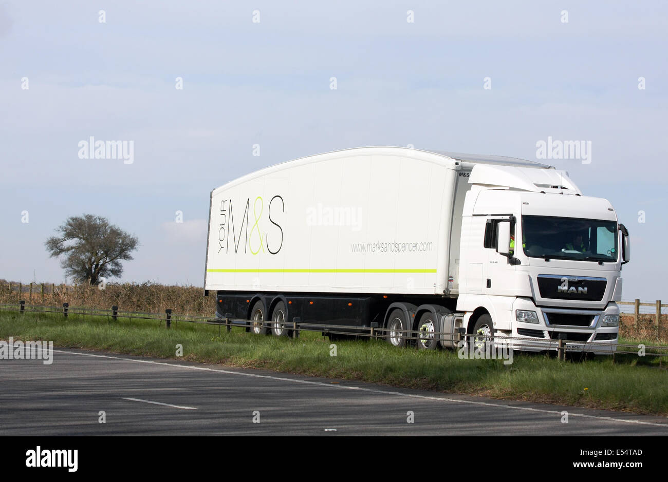 A M&S truck traveling along the A417 dual carriageway in The Cotswolds, England Stock Photo