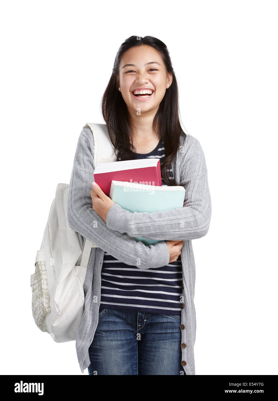 teenage girl with books and bag laughing Stock Photo - Alamy