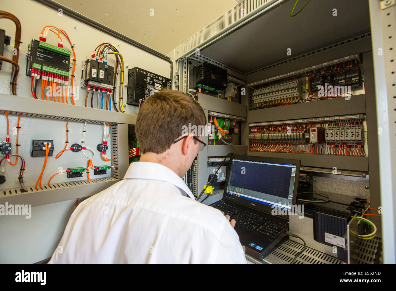 An engineer tests the new Tongue Gill hydro turbine, in Grasmere, Lake District, UK. Stock Photo