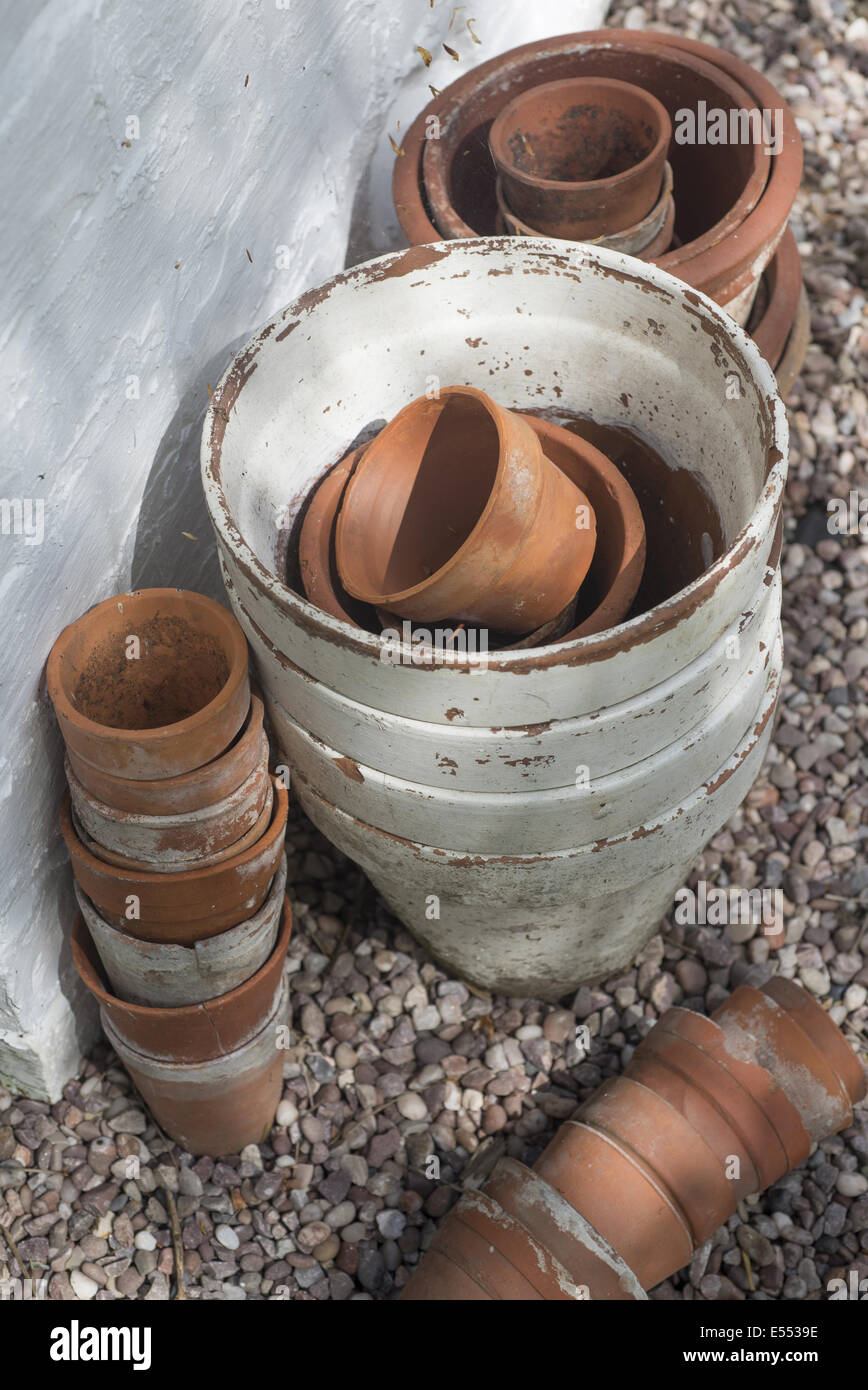 Terracotta flowerpots in garden, Kirk House, Chipping, Preston, Lancashire, England, May Stock Photo