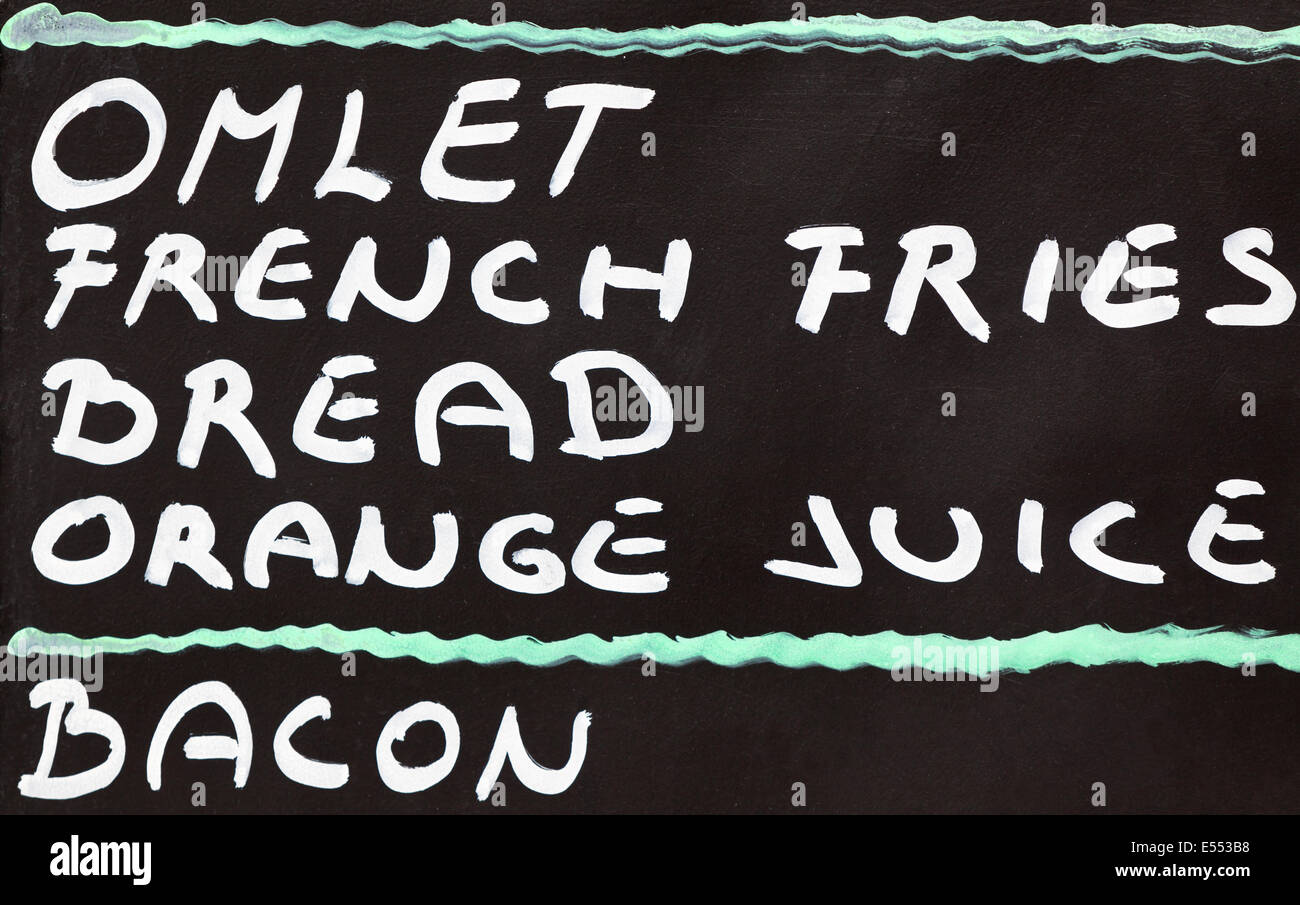 Street cafe breakfast menu written in chalk on a blackboard Stock Photo