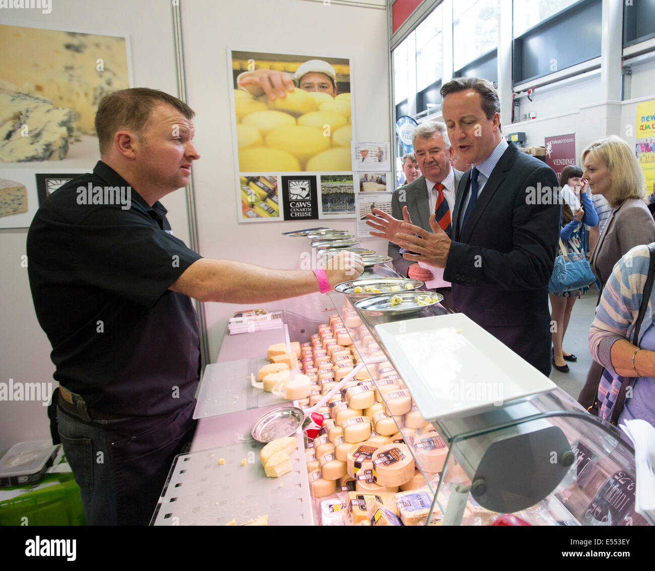 Llanelwedd, Builth Wells, Powys, Wales, UK . 21st July, 2014. Royal Welsh Show, Llanelwedd. Prime Minister David Cameron visits the Caws Cenarth stand at the Food Hall. Stock Photo