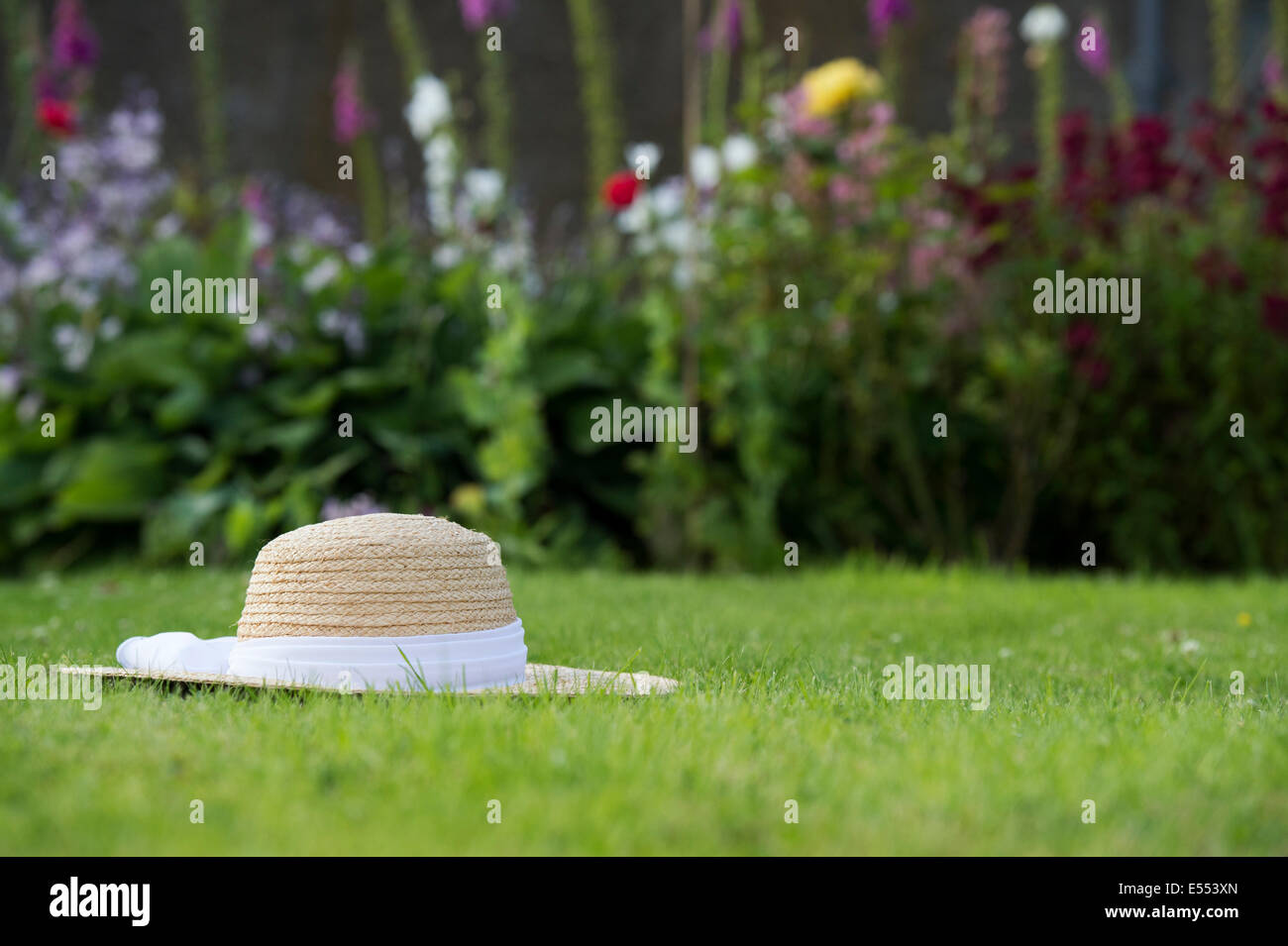 Straw Hat on a lawn Stock Photo Alamy