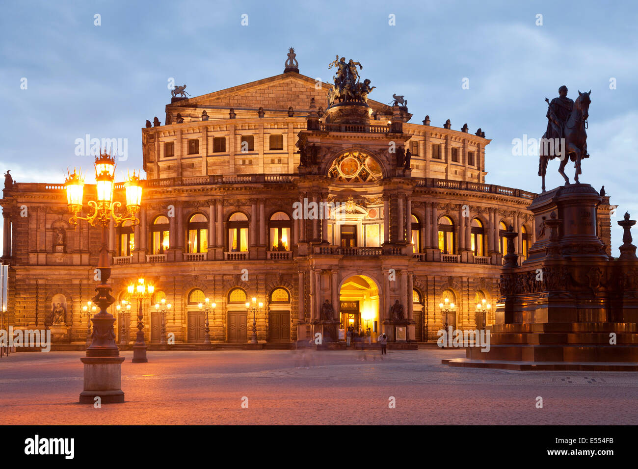 opera house Semperoper and Statue Of King Johann on Theater square in Dresden at night, Saxony, Germany, Europe Stock Photo