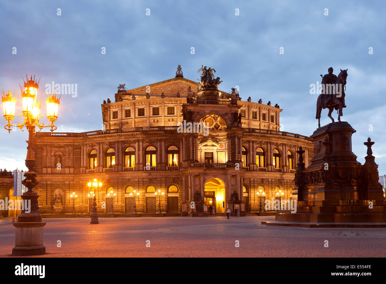 opera house Semperoper and Statue Of King Johann on Theater square in Dresden at night, Saxony, Germany, Europe Stock Photo