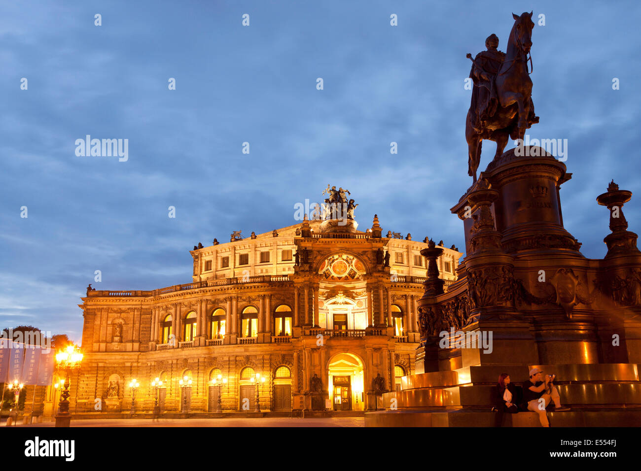 opera house Semperoper and Statue Of King Johann on Theater square in Dresden at night, Saxony, Germany, Europe Stock Photo