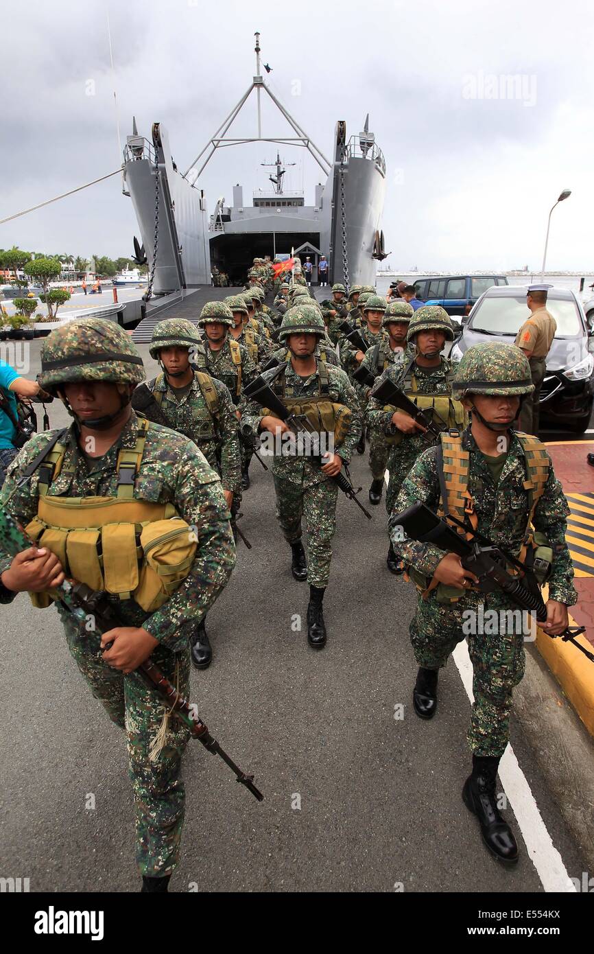 Manila, Philippines. 21st July, 2014. Members of the Marine Battalion Landing Team 5 (MBLT5) march from their naval ship during arrival ceremony inside the Philippine Navy Headquarters in Manila, the Philippines, July 21, 2014. More than 200 members of the MBLT5 arrived in Manila after serving almost 10 years in Northern Philippines. Credit:  Rouelle Umali/Xinhua/Alamy Live News Stock Photo