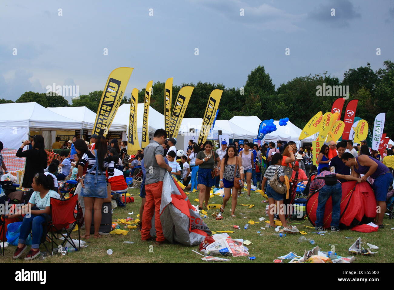 Walton, Surrey, UK. 20th July, 2014. The clean up after thousands of filipino's and their families gathered to celebrate their culture with a party. Credit:  Paul Hamilton/Alamy Live News Stock Photo