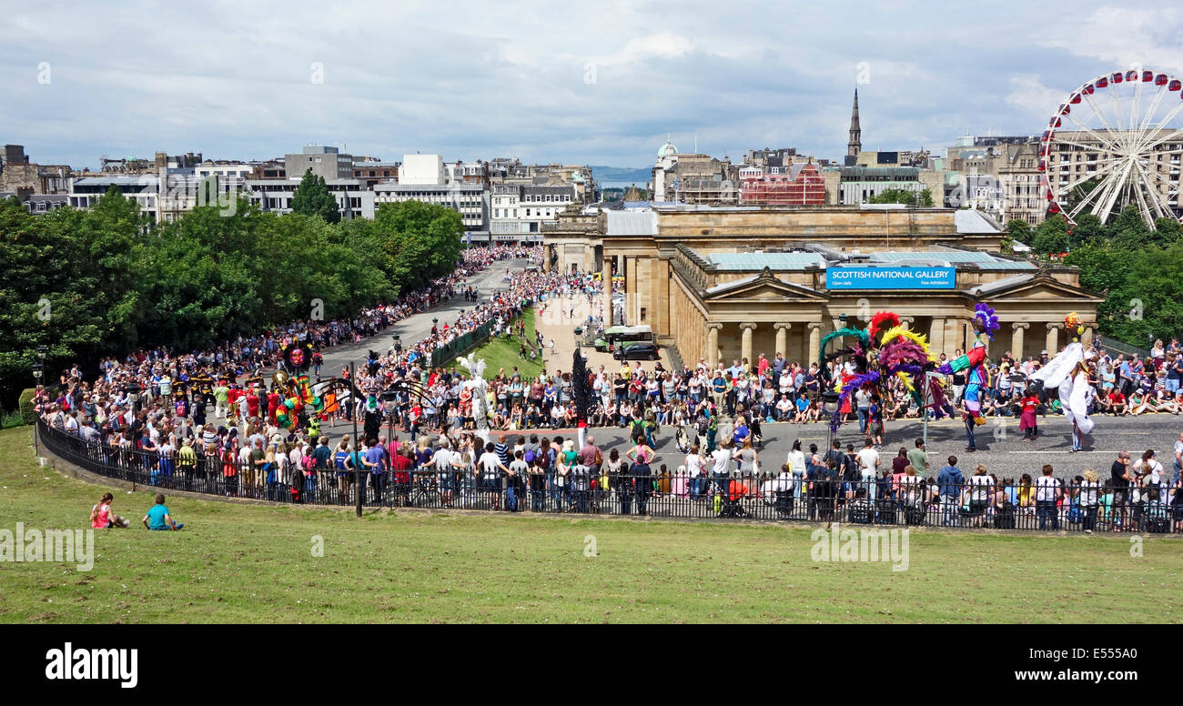 Participants and expectant onlookers line up on the Mound in Edinburgh to enjoy the Edinburgh Carnival on 20 July 2014 Stock Photo