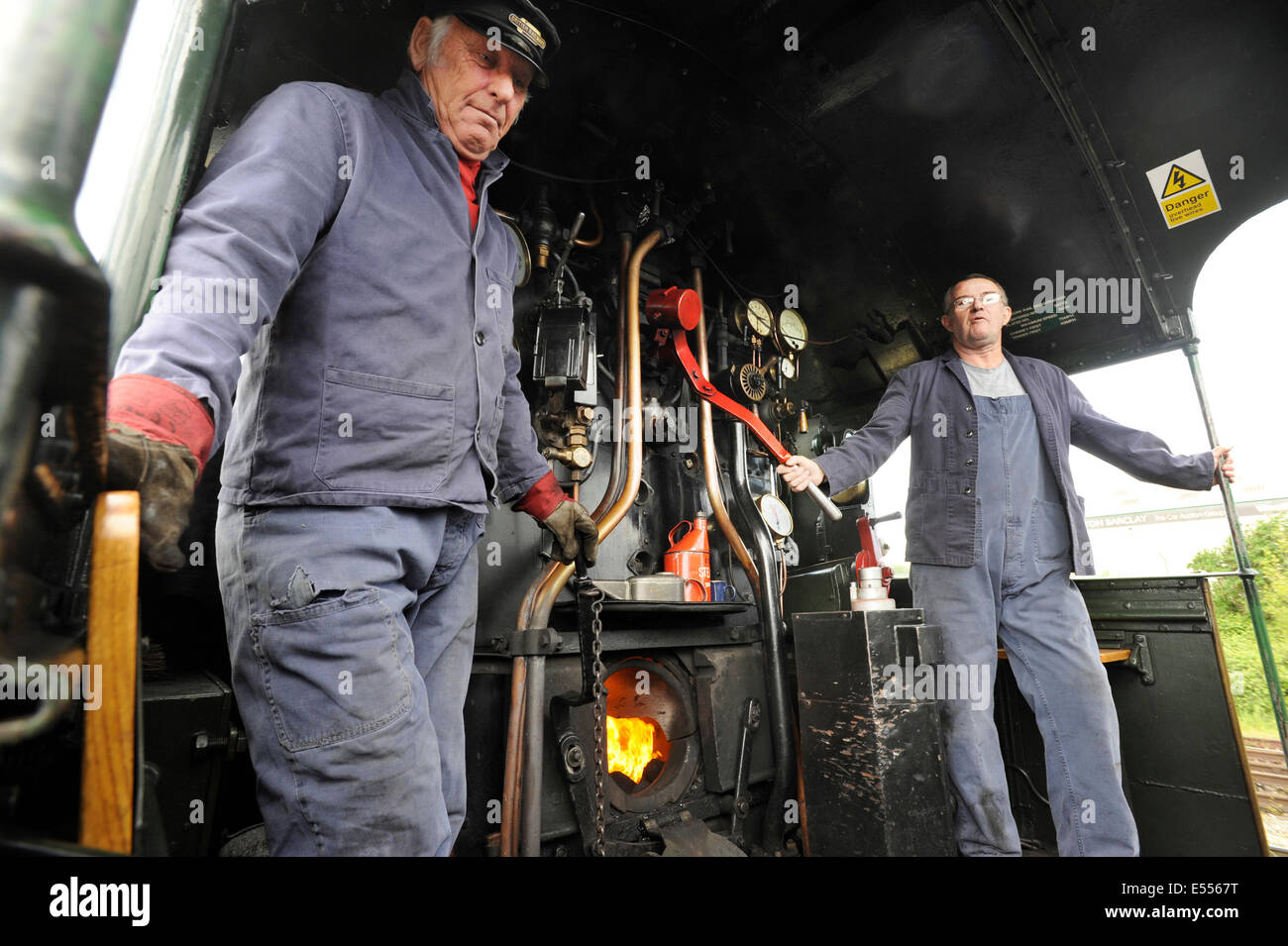 Fireman Steve Matthews and Driver Fred Lewis in the cab of Great Western Railway (GWR) Castle Class steam locomotive number 5029 'Nunney Castle' before it starts its train from Westbury to Plymouth, Devon. Stock Photo