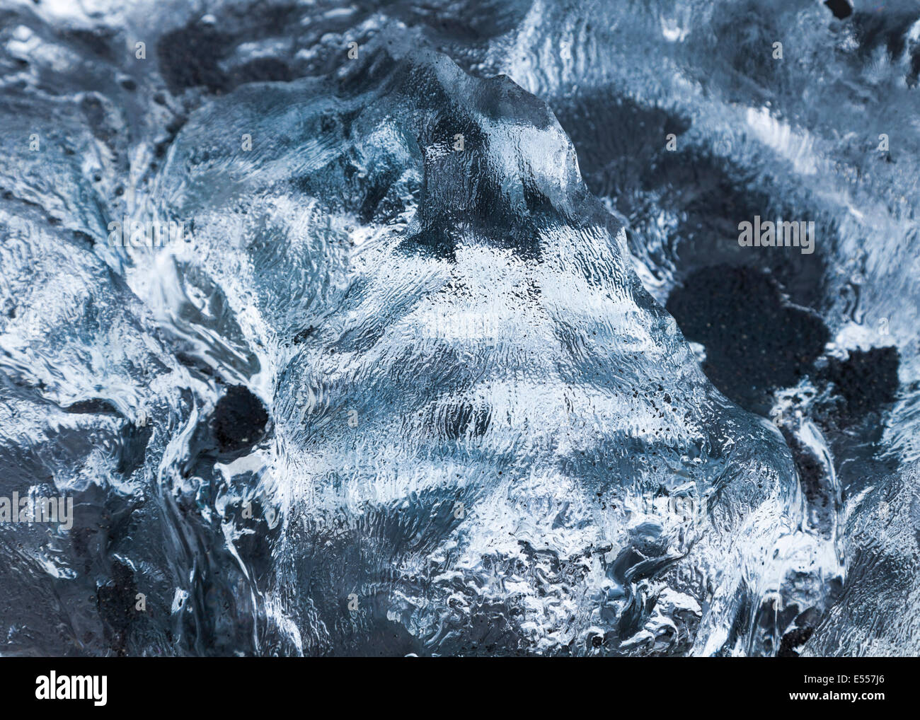 Close up of melting ice piece on the black sand beach near Jokulsarlon