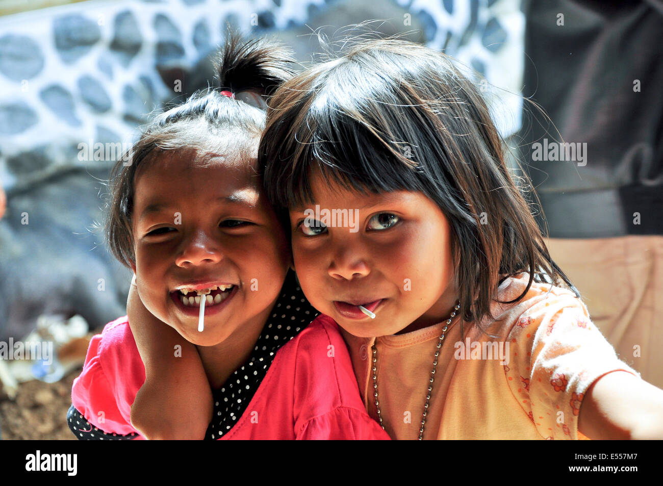 Children with sweets, Tana Toraja, Sulawesi, Indonesia Stock Photo