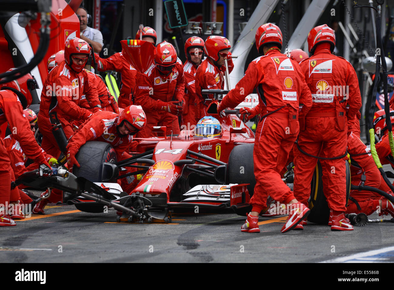 Hockenheim, Germany. 20th July, 2014. Spanish Formula One driver Fernando Alonso from team Ferrari does a pit stop during the German Formula One Grand Prix at the Hockenheimring race track in Hockenheim, Germany, 20 July 2014. Photo: DAVID EBENER/DPA/Alamy Live News Stock Photo