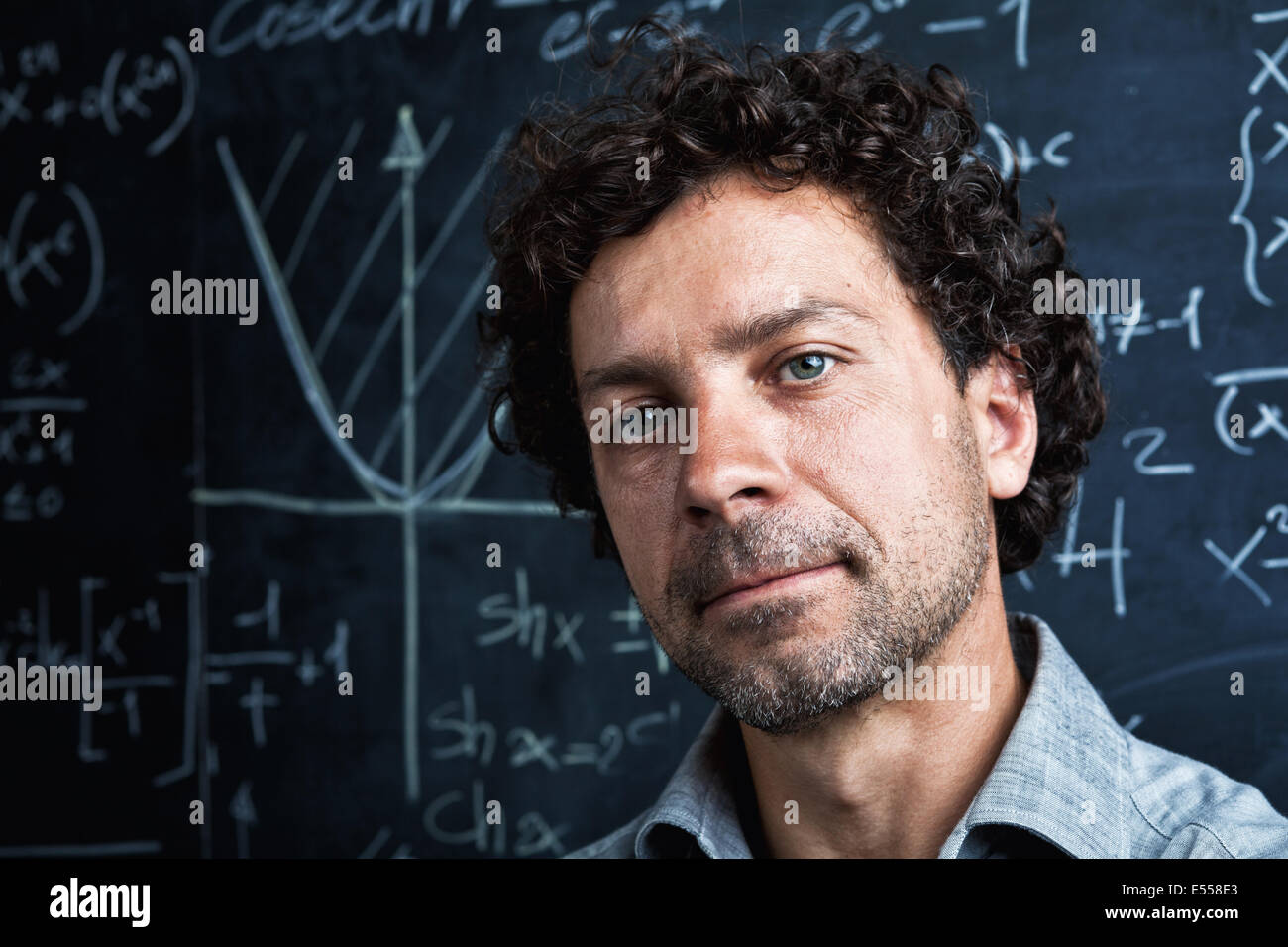 portrait of caucasian teacher and blackboard background Stock Photo Alamy
