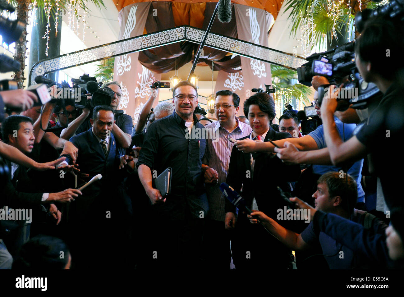 Sepang, Malaysia. 19th July, 2014. Malaysia's defence minister, Hishamuddin Hussein, left, accompanied by the newly elected transport minister, Liow Tong Lai arrives a hotel in Sepang as it enters the second day of the of the Flight 17 crash in Ukraine in Sepang, Malaysia, Saturday, July 19, 2014. Credit:  Joshua Paul/NurPhoto/ZUMA Wire/Alamy Live News Stock Photo