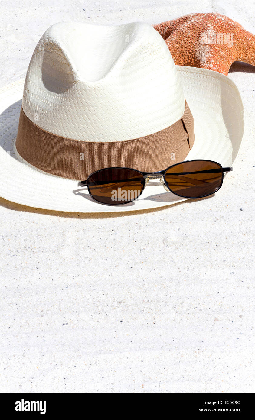 Straw Hat with Sunglasses and a Sea star on the Beach Stock Photo - Alamy