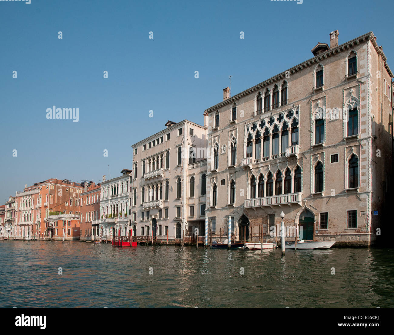 Beautiful palaces buildings houses palazzo pallazi with moored motor boats on the Grand Canal Venice Italy  GRAND CANAL PALACES Stock Photo