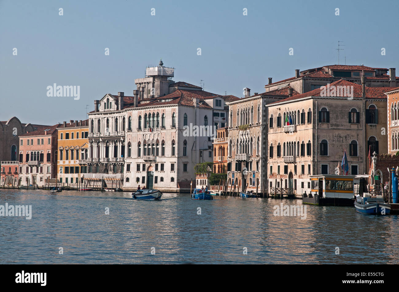Grand Canal Venice Italy with Ca Rezzonico Vaporatto fermata stop and Hotel Palazzo Stern in early morning sunshine  GRAND CANAL Stock Photo