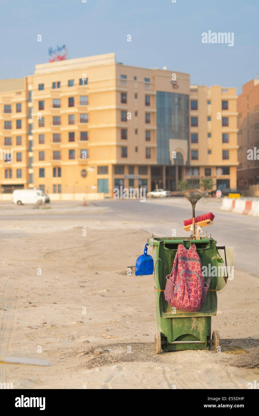 A Street Cleaners cart sitting along the road in Al-Seef, Manama Bahrain. Stock Photo