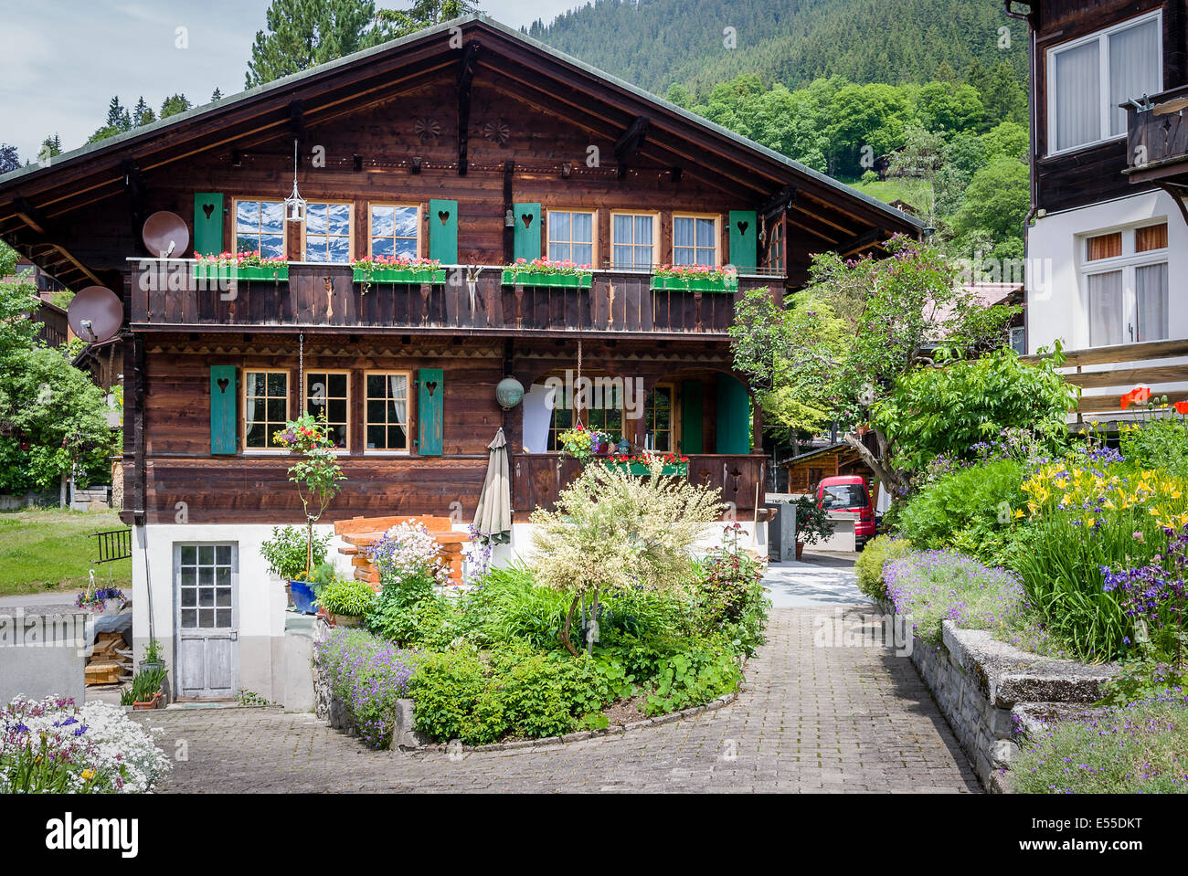 Wooden chalet typical of Swiss architecture in Wengen Stock Photo