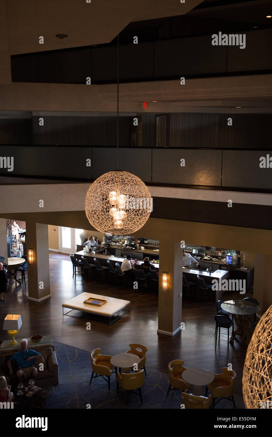 View of hotel lobby from mezzanine level with lighting fixtures Stock