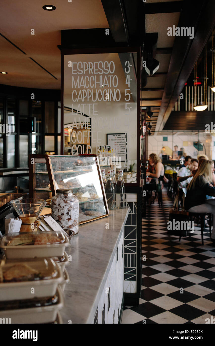 Weekend Morning At Trendy Los Angeles Restaurant And Cafe With Menu Written On Mirror And Pastries In The Foreground Stock Photo Alamy