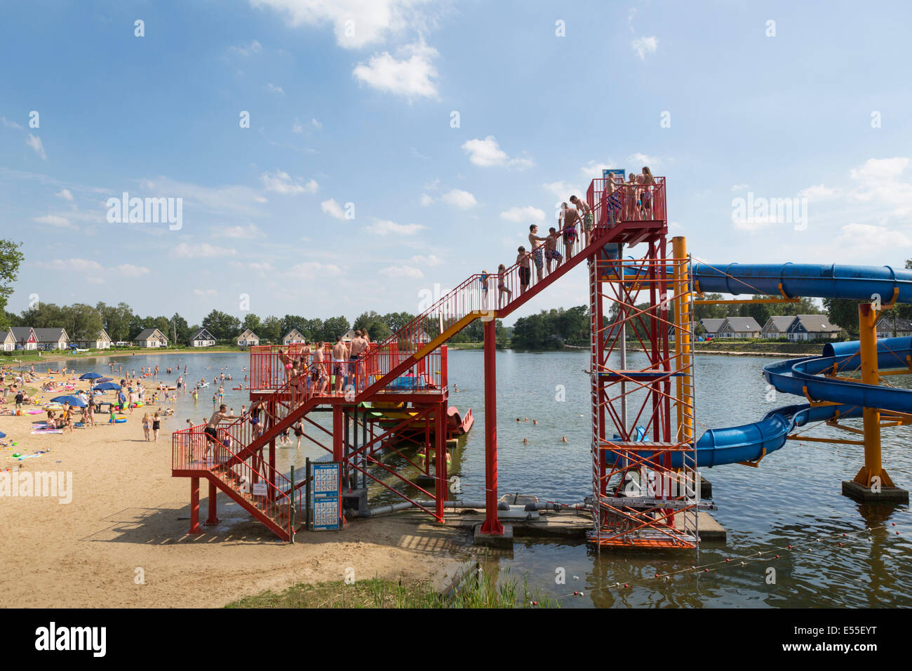 Lake with slide and swimming people in the Netherlands Stock Photo
